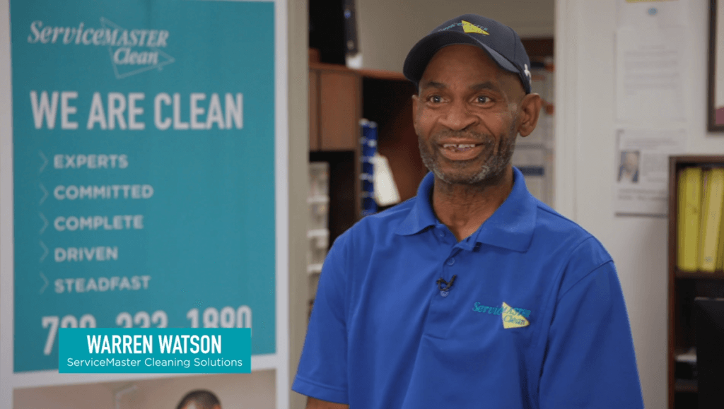 Warren Watson - Clean hero of the year standing next to a poster that reads "we are clean"